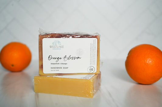 Westlake Handmade Orange soap bar with two oranges on a white background