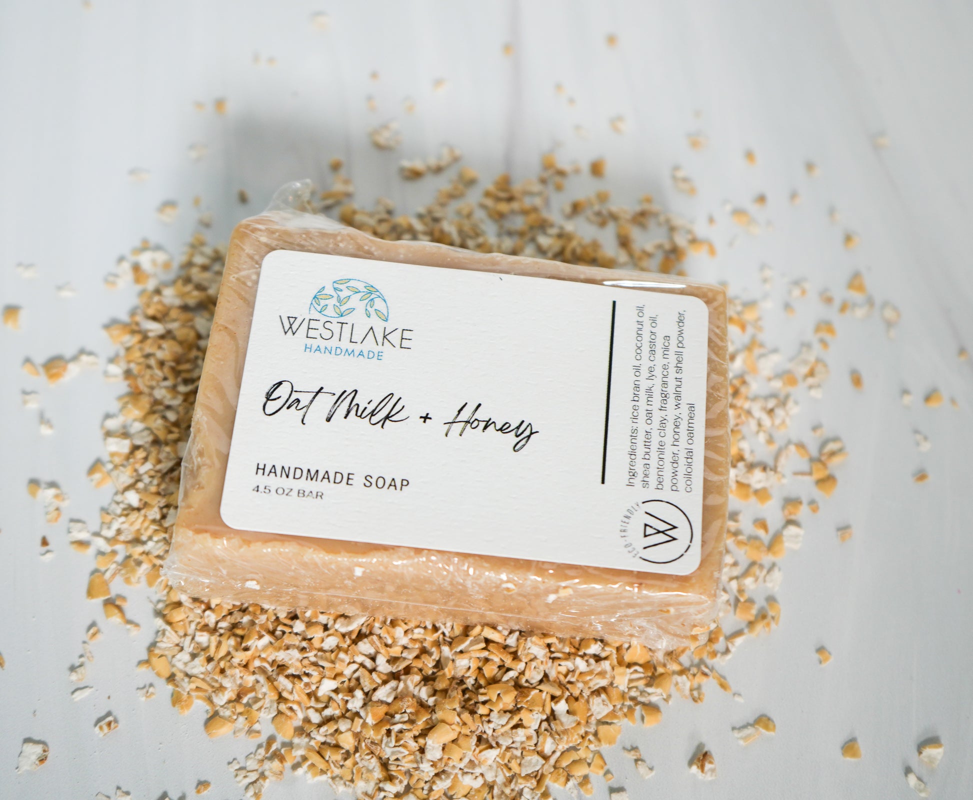 Handmade soap bar with 'Westlake Handmade' label on a light background with oats around