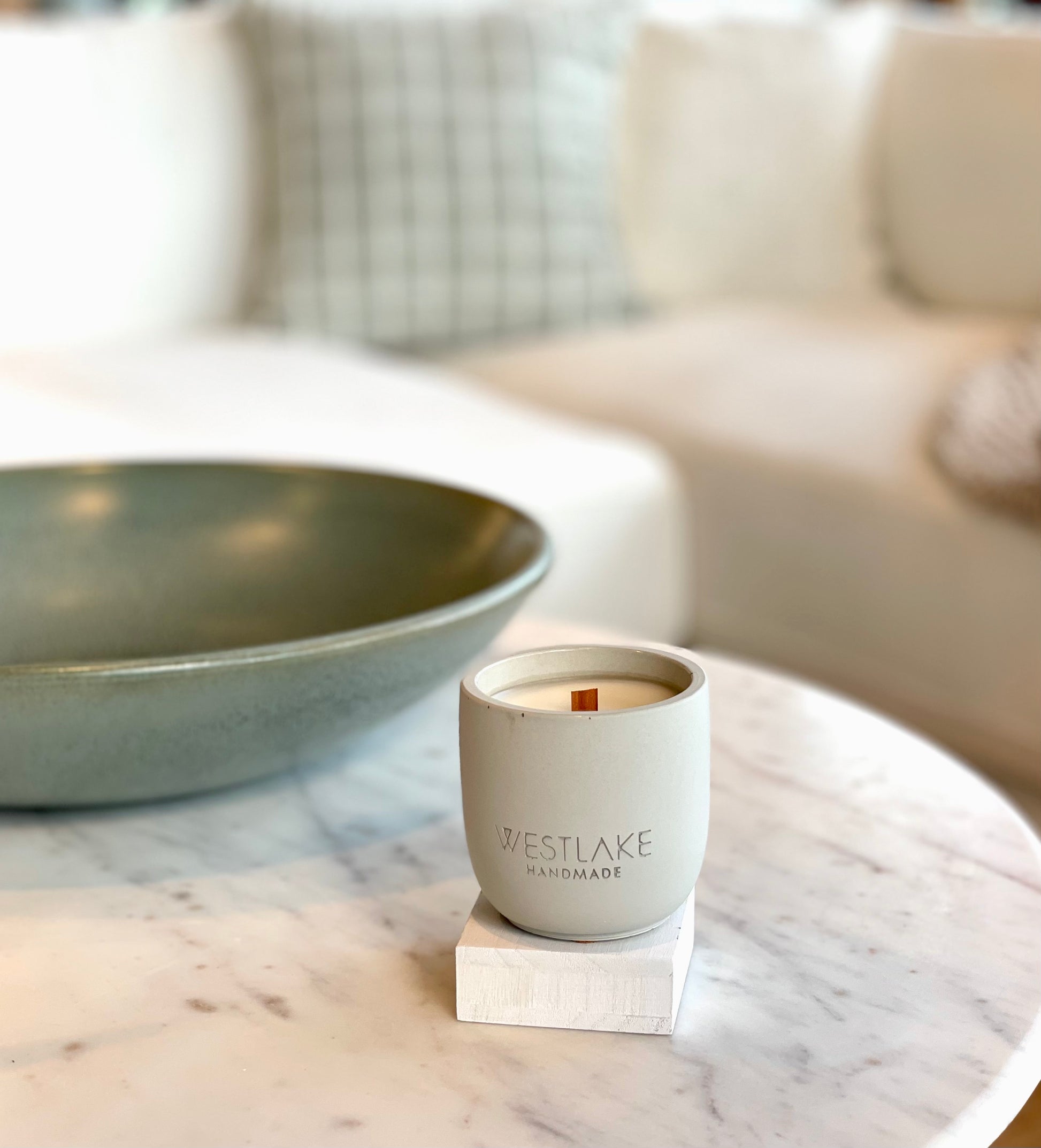 Westlake Handmade candle on a marble surface with a blurred background