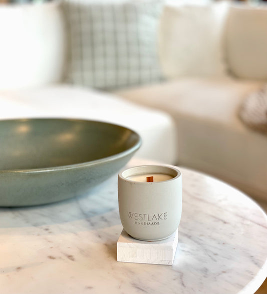 Westlake Handmade candle on a marble surface with a blurred background