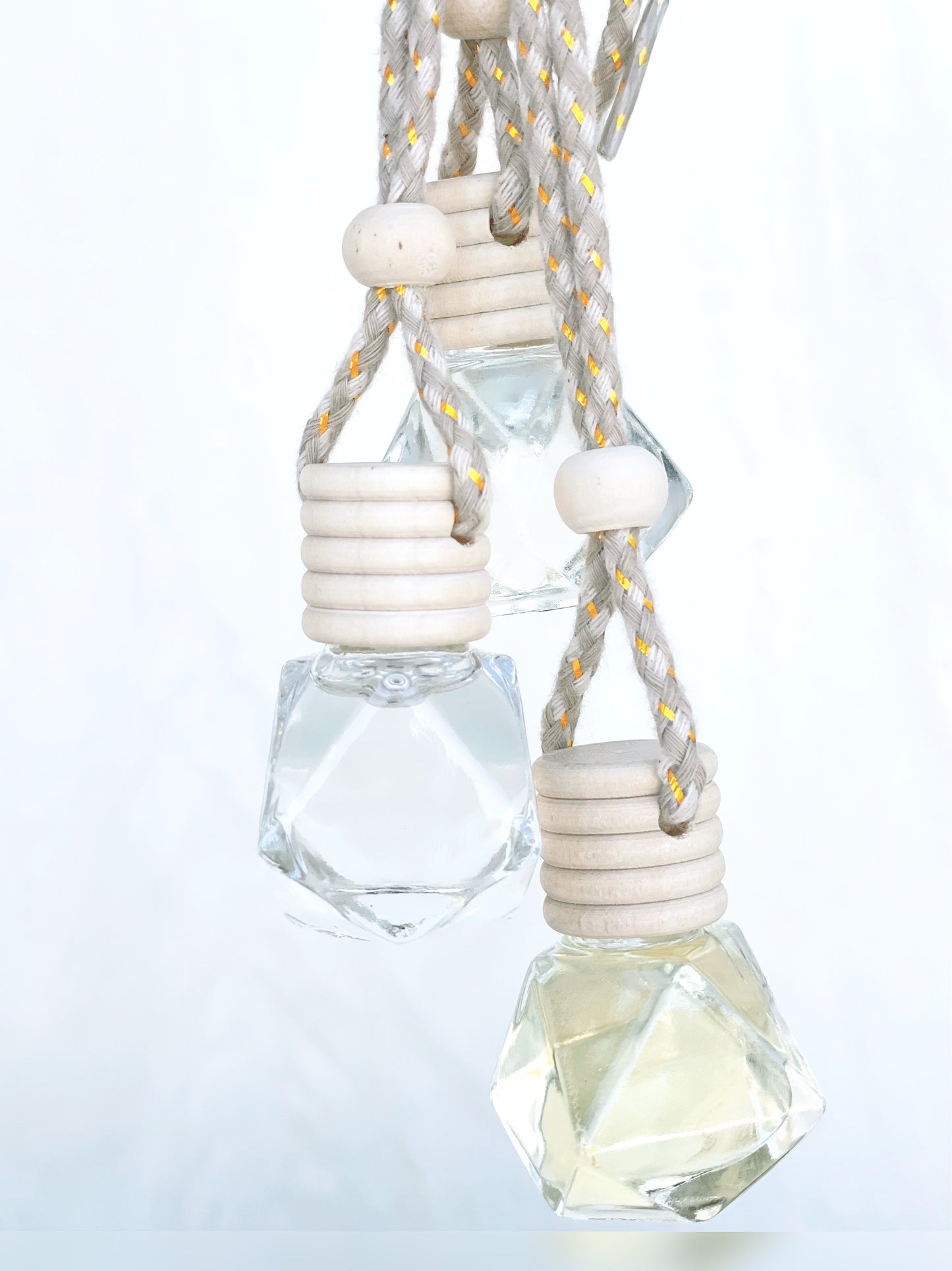 Westlake Handmade travel diffusers with geometric design and white beads on a light gray background