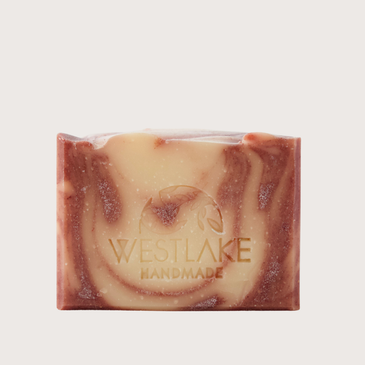 Westlake Handmade soap bar with red and orange swirls on a light background